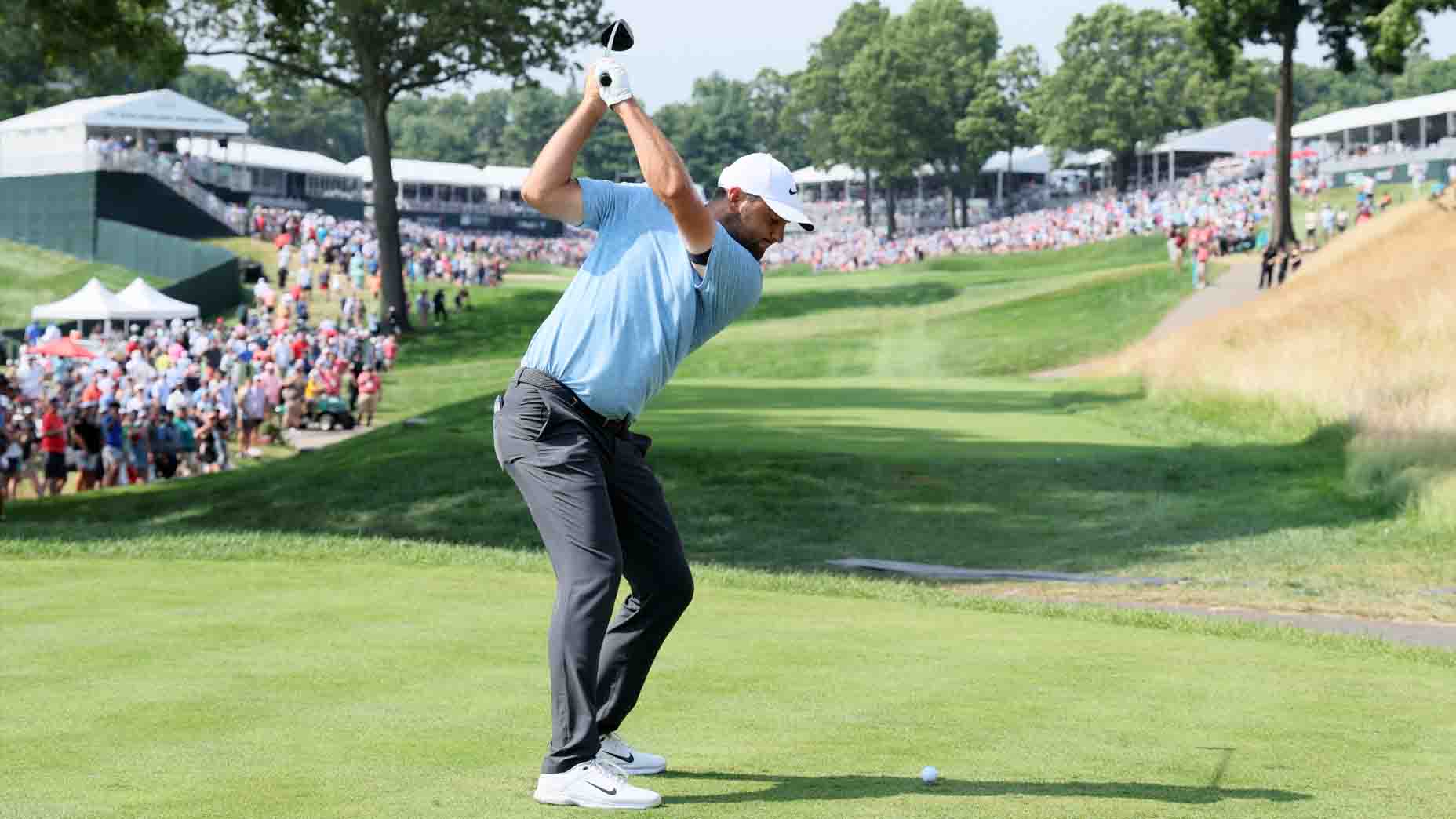 Scottie Scheffler hits a tee shot during the 2024 Travelers Championship
